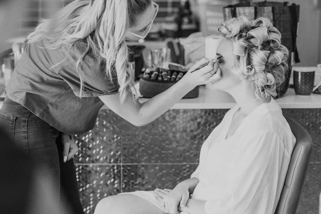 Brooke Brianna finishing brides makeup before wedding captured by candid hunter valley wedding photographer James White