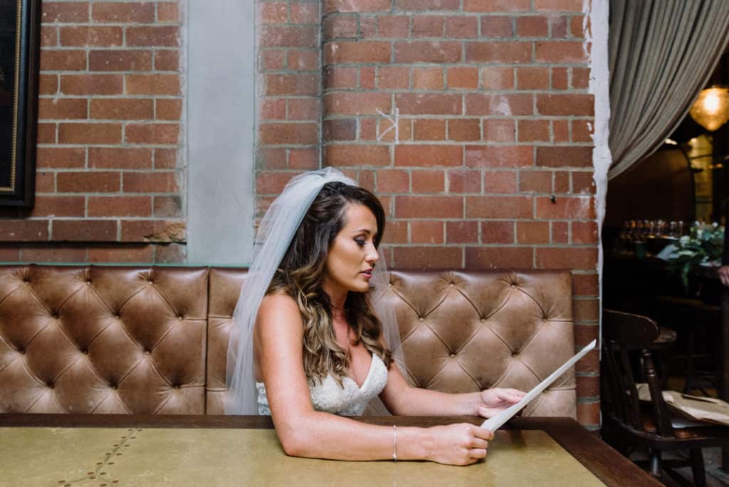 bride checking wedding vows one last time before ceremony captured by james white photography