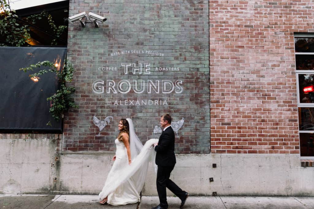 bride and groom in urban setting after wedding ceremony captured by james white photography