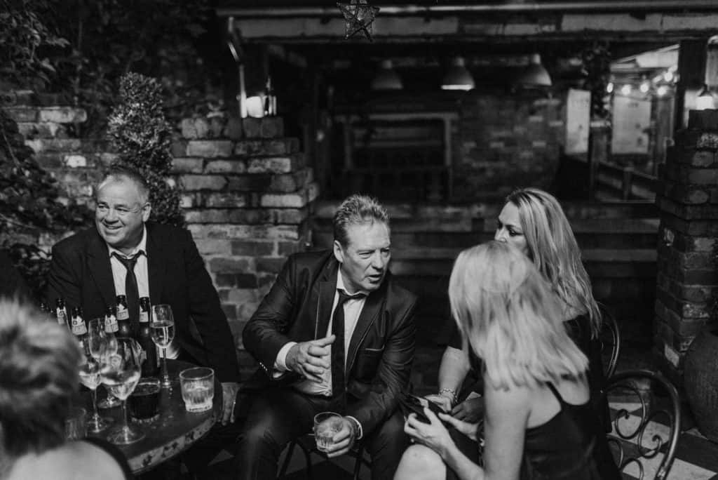 guests mingling at grounds of alexandria during reception captured by james white photography