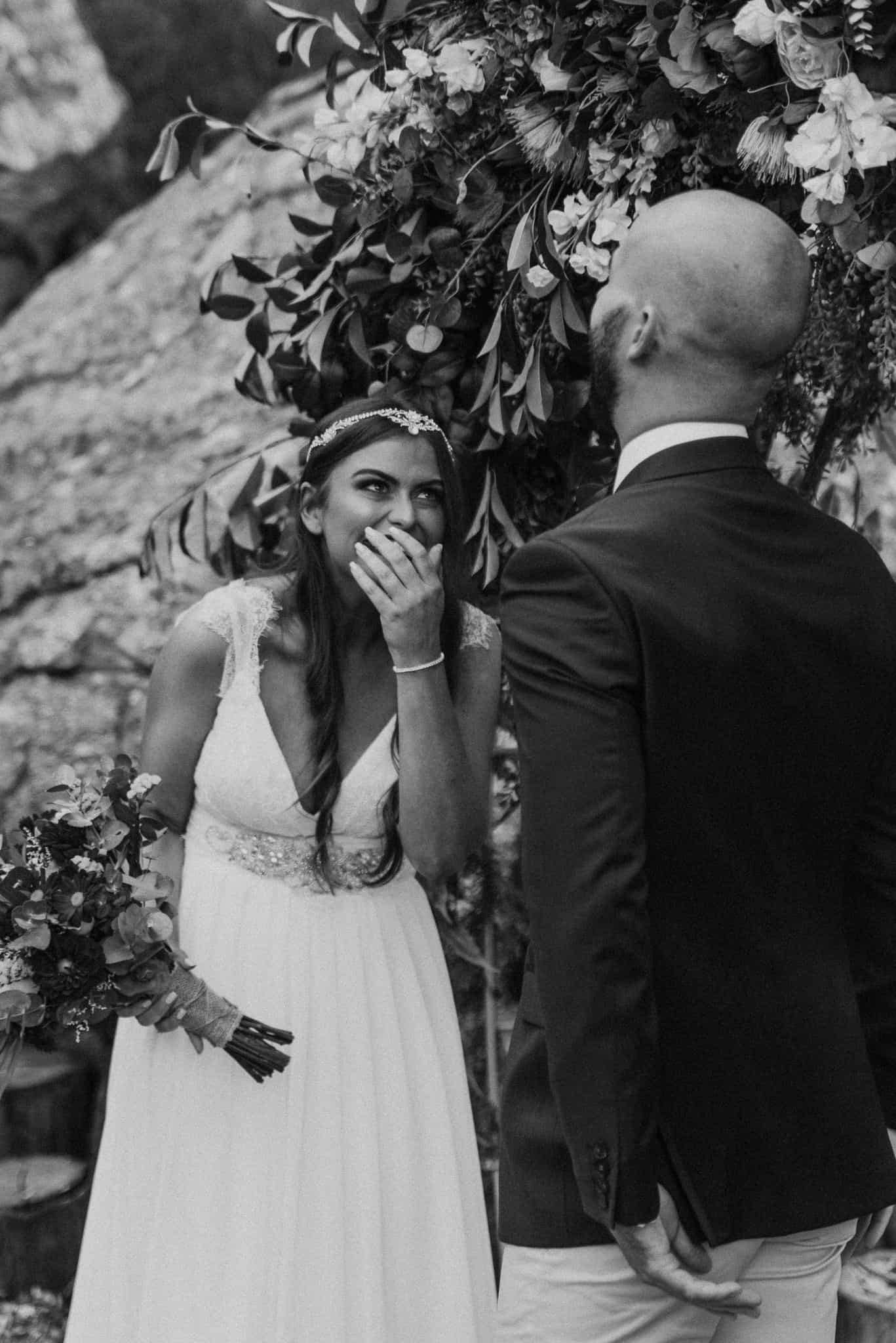 Bride laughing at groom during vows Captured by James White Hunter Valley Wedding Photographer
