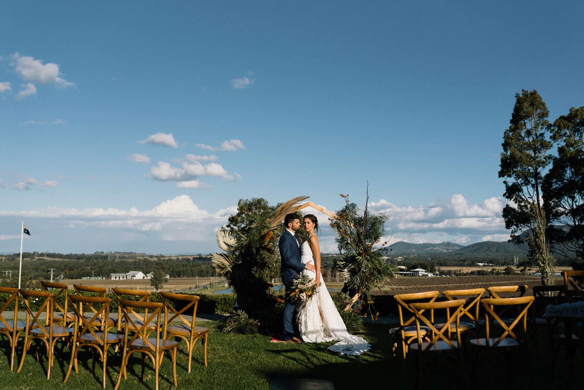 Boho Ceremony setup with hexagonal timber arbour in the courtyard at Estate Tuscany Captured by James White Hunter Valley Wedding Photographer