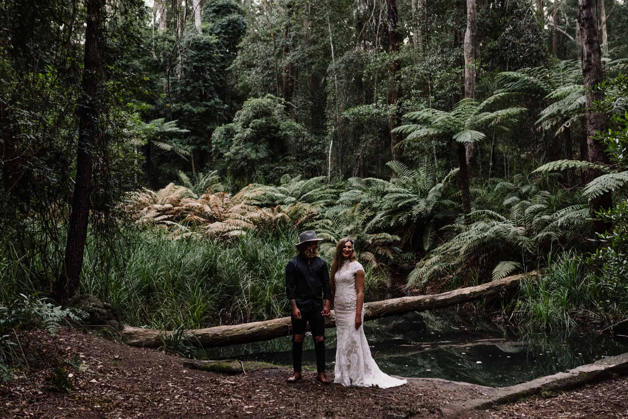Bride and groom enjoy gorgeous lighting for their pine forest photos after following wedding day timeline