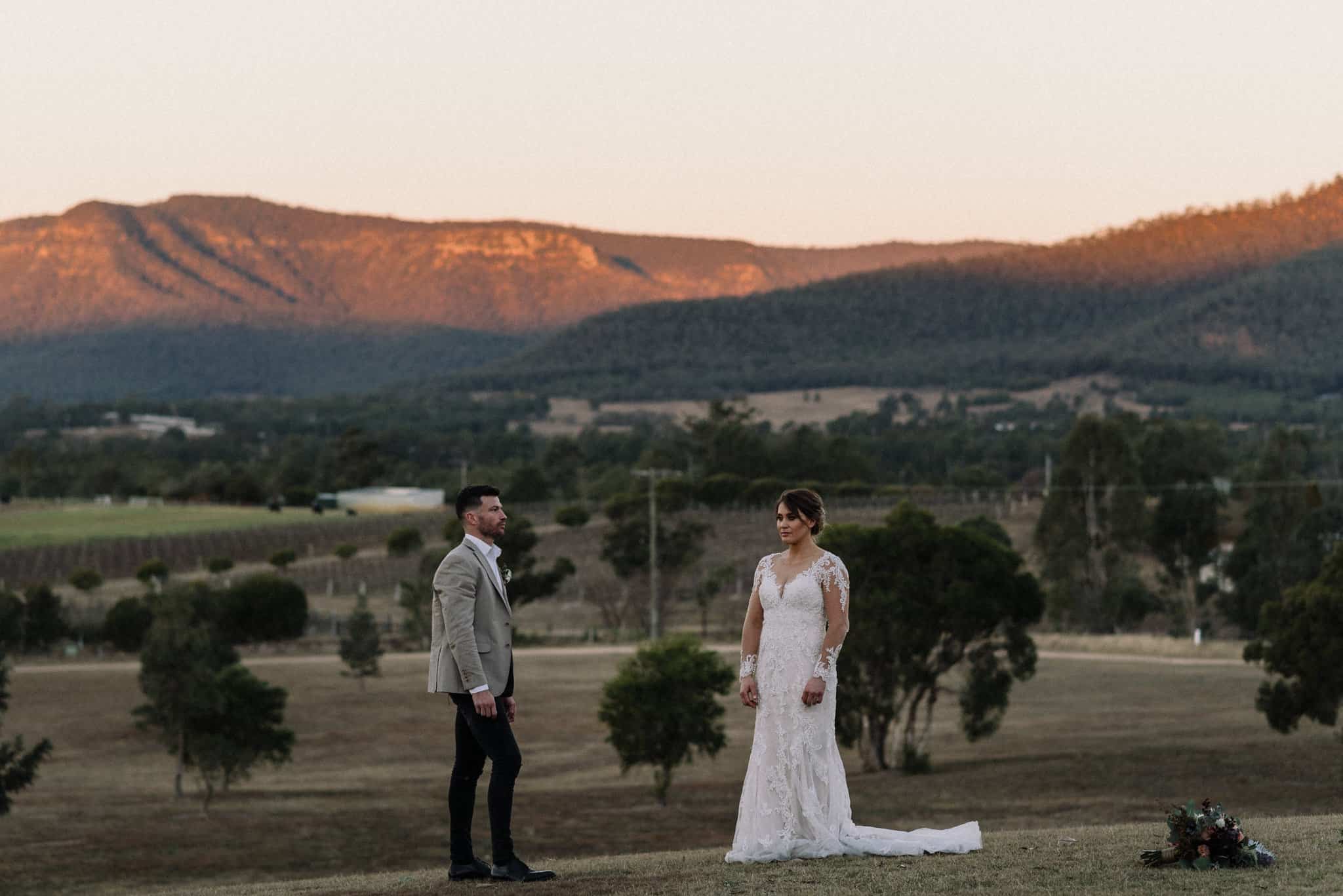 The perfect wedding day timeline allows bride and groom to have stunning sunset photos in front of mountains