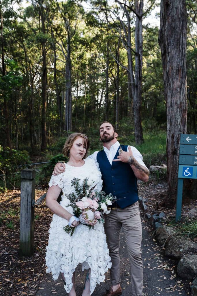 bride and groom about to start trek to elopement ceremony location in Glenrock captured by james white newcastle wedding photographer