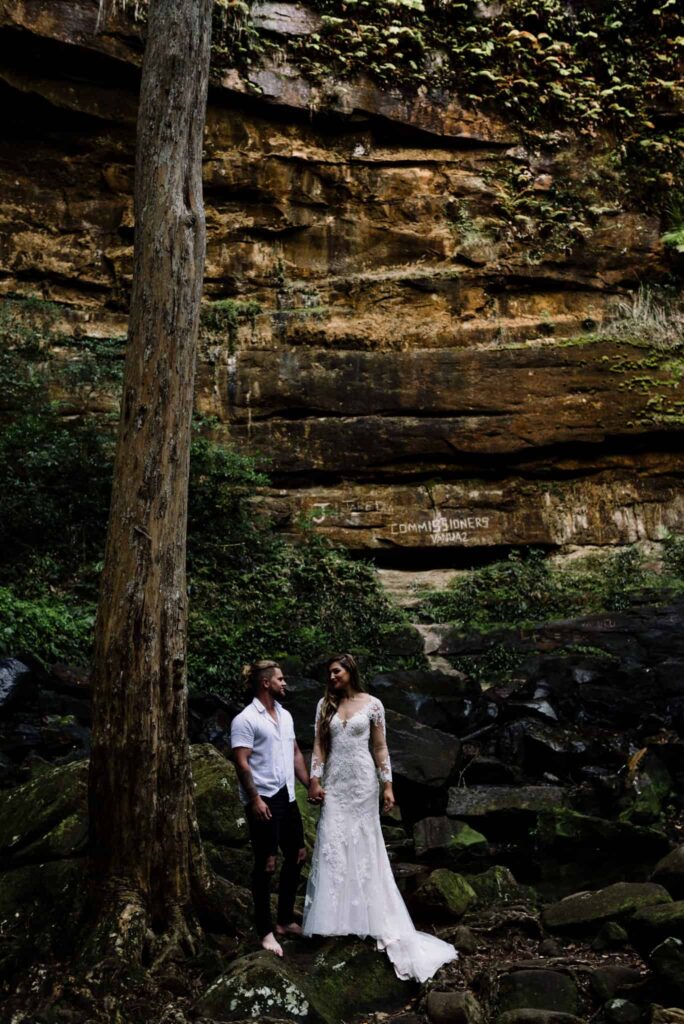 Bride and groom elope under waterfall at Gap Creek in Australia