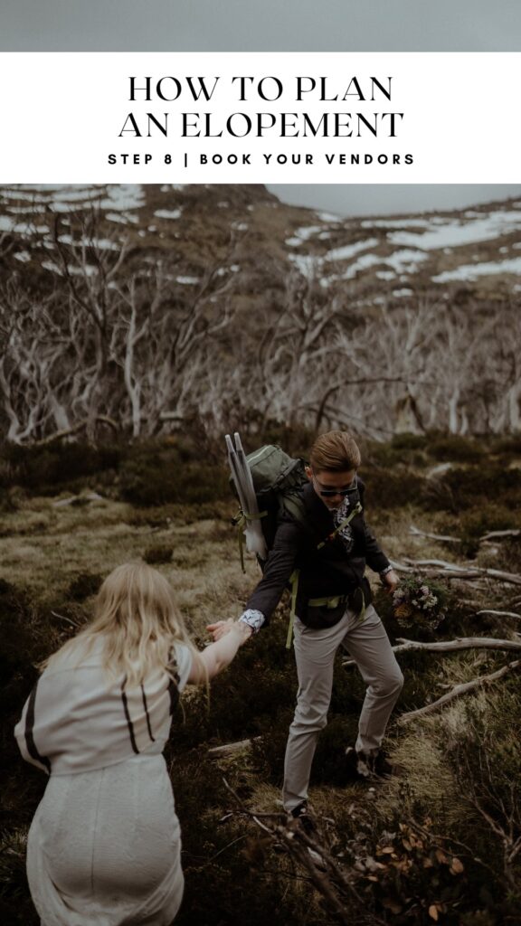 Step 8 on how to plan an elopement is to book all your vendors. Bride and groom hiking up Mt Kosciusko in the snow to their elopement ceremony. 